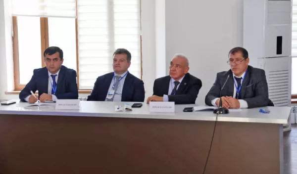 Panel of urologists in blue suits.